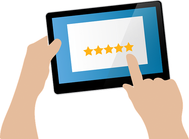 A hand tapping five stars on a tablet screen, indicating a high rating.